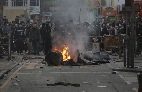 Smoke rises as rioters set fires on a street in Mong Kok. The jury is still out on the impact the riot will have on Hong Kong’s politics. Photo: AP