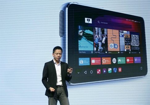 ZTE’s Waiman Lam presents the new 'Spro Plus' device, a small portable projector with a 2K resolution, 8.4-inch touch screen, during a preview day at the MWC yesterday. The event runs from Monday to Thursday. Photo: EPA