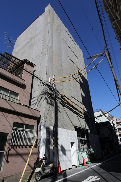 A building under construction owned by Jeffery. She is investing in condominiums tailored for customers of Airbnb, but new guidelines for home sharing could make most Airbnb rentals in the country illegal.