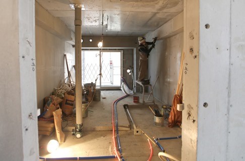 A labourer works inside a building under construction owned by Aileen Jeffery in Tokyo.