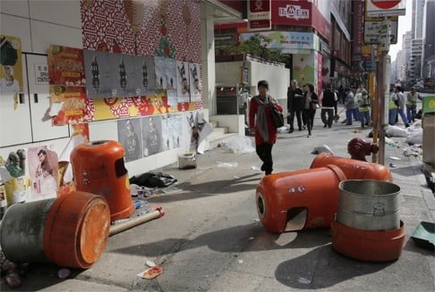 Mong Kok streets in disarray a day after the rioting. Research shows that students who don’t see compliance with the law as an important attribute of a good adult citizen are more prone to take part in illegal protests later in life. Photo: AP