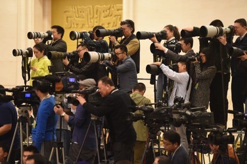 Media attend a press conference at last year’s sessions. China’s economic policies for the year ahead will have consequences that extend far beyond its borders. Photo: Xinhua