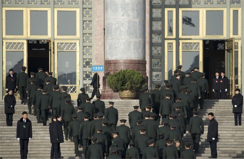 Deputies to the 12th National People's Congress from the PLA enter the Great Hall of the People last March. The military is in the midst of an intense shake-up, and ensuring the loyalty of the top brass is crucial for Xi to carry out his agenda. Photo: Xinhua