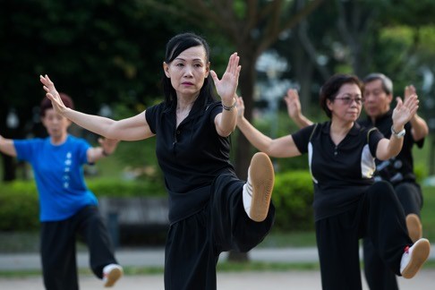 People practise tai chi in a park in Singapore. After a dismal showing at the general election in 2011, the ruling party began to adjust its immigration policies, and Singaporeans were assured in meaningful ways that they mattered more than the newcomers. Photo: Bloomberg