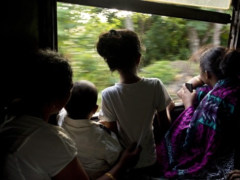 Passengers on a train in Sri Lanka. Munaweera’s novel travels from Sri Lanka to the United States.