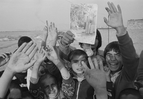 Children with a picture of Ayatollah Khomeini in Tehran in 1979. Photo: Corbis
