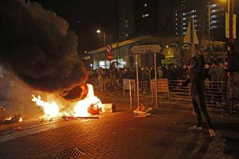 A united democratic front needs to insist on non-violence. The vast majority of residents want to see the back of Chief Executive Leung Chun-ying. At that same time, they do not condone youngsters hurling bricks at the police. Photo: AP