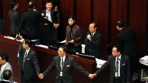 Raymond Chan was later surrounded by security and removed from the committee chairman’s seat. Photo: Felix Wong