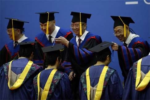 Lin Jianhua (second right, back row), attends a graduation ceremony in 2014 at Zhejiang University, where he was president before taking over Peking University. He enjoys a rank equivalent to a deputy government minister, but thinks the system hinders the mission of education. Photo: Xinhua