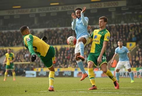 Norwich City’s Martin Olsson and Ryan Bennett corner Manchester City’s Raheem Sterling. Photo: Reuters