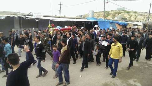 Mourners carry the coffin of Fatma Samir, who died after the attack. Photo: AP