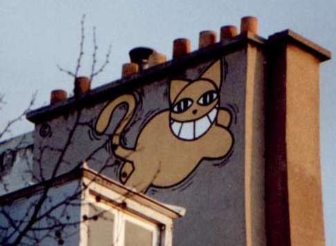 One of M. Chat’s signature paintings on the side of a building in Paris. Photo: Wikimedia Commons