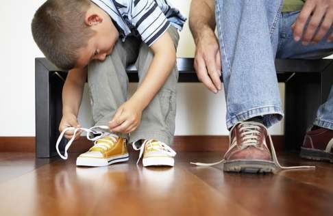 When your children aren’t doing their own shoelaces up, but leaving it to your domestic helpers, it’s a sign there’s something wrong with Hong Kong life. Photo: Corbis
