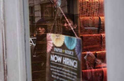 A “Now Hiring” sign hangs in a window in lower Manhattan in New York City. Since 2000, China has invested tens of billions of dollars in the US, generating tens of thousands of jobs. Photo: AFP