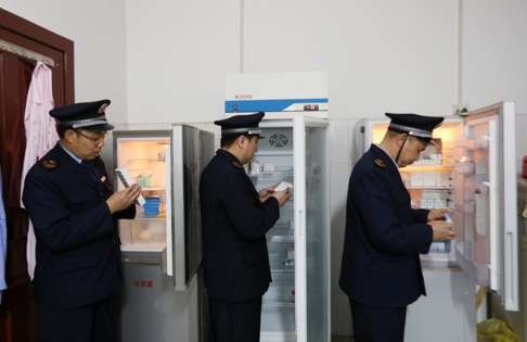 Authorities check vaccines stored in the local Centre for Disease Control in Guangxi. Photo: EPA