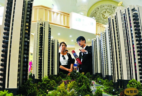 A prospective homebuyer in Shanghai. Anecdotal evidence suggests that costs for an average dwelling may have surged more than 50 per cent. Photo: Reuters