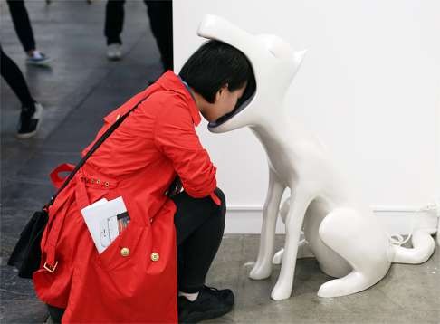 A visitors looks at an art installation 