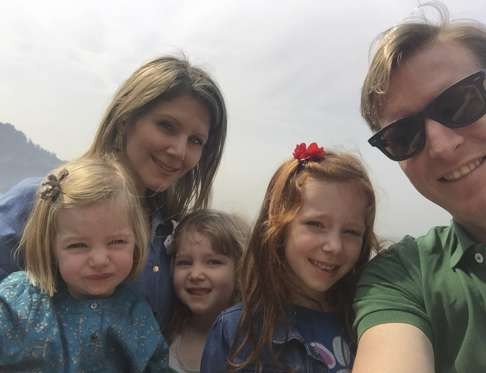 Melissa and Simon Brewster with their children Grace, Gia and Gemma.