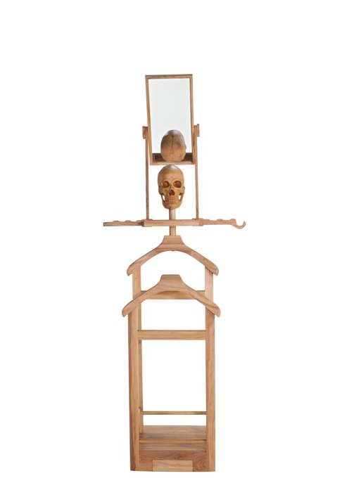 Valet is an elm wood suit stand crowned by a life-sized hand-carved skull. Photo: Enrico Marone Cinzano
