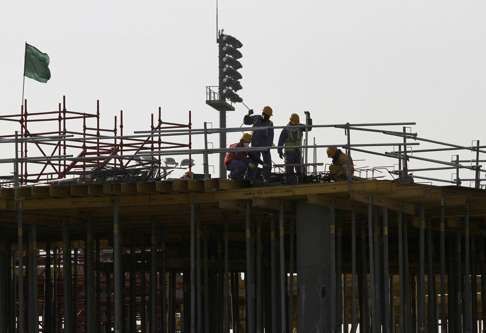 Migrant labourers work at a construction site at the Aspire Zone in Doha. Photo: Reuters