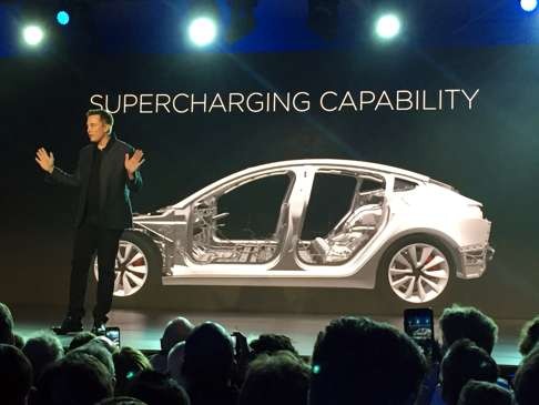 Tesla Motors CEO Elon Musk speaks at the unveiling of the Model 3 at the Tesla Motors design studio on Thursday in Hawthorne, California. Photo: AP