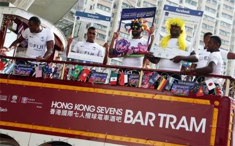 Fiji players ride the Hong Kong Sevens Bar Tram Kick-off at Whitty Street on Wednesday. Photo: K. Y. Cheng
