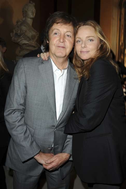 Stella McCartney and proud dad Paul at the designer’s show at Paris Fashion Week in 2011. Photo: Corbis