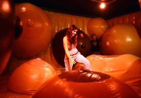 Visitors play in a Museum of Sex exhibit by British conceptual artists Bompas & Parr. Photo: AFP