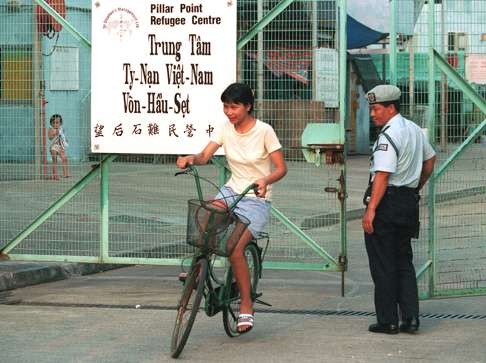 The Pillar Point refugee camp was the last one housing Vietnamese boatpeople to close in Hong Kong in May, 2000. The man in uniform is a Gurkha guard from Nepal. Photo: Dustin Shum