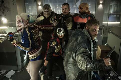 The Suicide Squad includes Margot Robbie as Harley Quinn (left), Jai Courtney as Captain Boomerang (right) and Will Smith as Deadshot (back row, right). Photo: Clay Enos