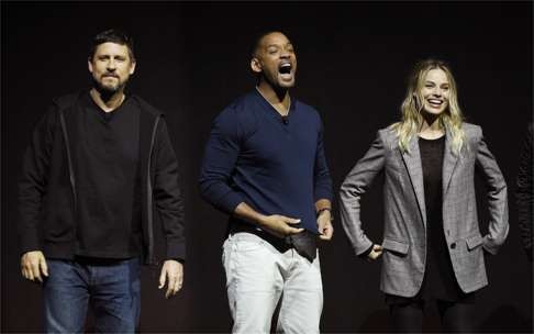 (From left) Suicide Squad director David Ayer takes to the stage with cast members Will Smith and Margot Robbie during the Warner Bros. presentation at CinemaCon 2016 in Las Vegas on April 12. Photo: AP