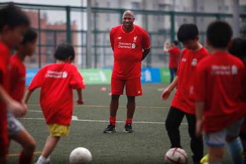 John Barnes oversees a Liverpool FC Soccer Clinic in Hong Kong. Photo: AFP