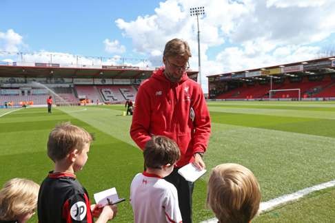 Juergen Klopp signs autographs for fans before last week’s match against Bournemouth. Photo: Reuters