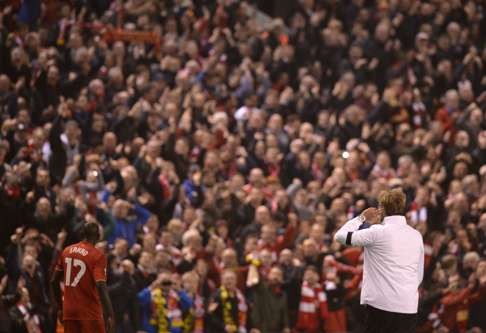 Juergen Klopp celebrates in front of the fans after winning the Europa league quarter-final second against Borussia Dortmund. Photo: AFP