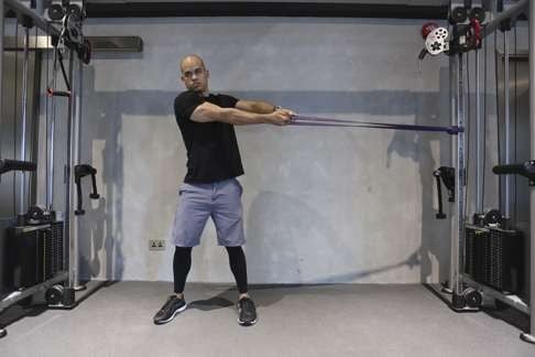 Resistance band external rotation scapula stretch. Photo: Jonathan Wong