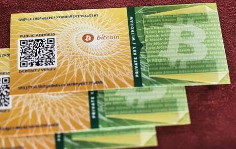A stack of Bitcoin paper wallets, printed certificates containing data to generate redeemable Bitcoin keys for single use. Photo: Corbis