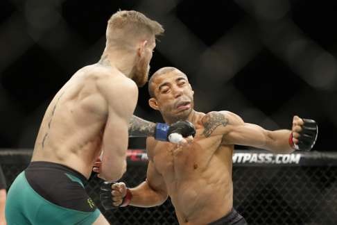 McGregor’s record-setting knockout of Jose Aldo launched him into MMA superstardom. Photo: AP