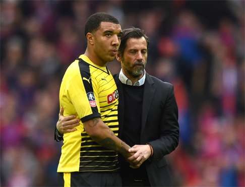 Watford's Troy Deeney with manager Quique Sanchez Flores as they look dejected at full time. Photo: Reuters  