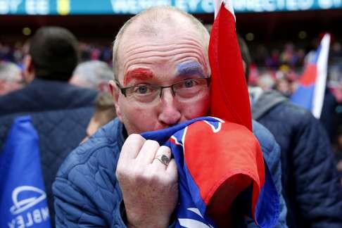Crystal Palace fans celebrate after the match. Photo: Reuters