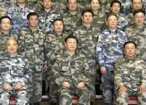 Xi Jinping (centre) with military staff at the Joint Operation Command Centre in Beijing, in this image taken from video footage . Photo: CCTV via AP Video