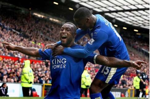 Leicester City captain Wes Morgan celebrates the equaliser with teammate Jeff Schlupp in their 1-1 draw with Manchester United at Old Trafford. Photo: EPA