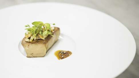 Epure's seared duck foie gras with crushed hazelnuts and almonds, and black pepper and sylvaner wine vinaigrette.