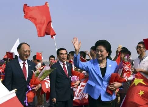 China's Vice Premier and head of the Beijing 2022 delegation Liu Yandong waves as she is welcomed upon her return at the airport, along with Beijing's Mayor and President of the Beijing 2022 delegation Wang Anshun (C) and China's Minister of the General Administration of Sport Liu Peng (L) in Beijing, China, August 2, 2015. Beijing was chosen by the International Olympic Committee (IOC) to host the 2022 Winter Olympics. Photo: Reuters