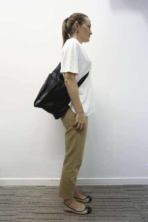 Writer Rachel Jacqueline shows the correct way to carry a sports bag.