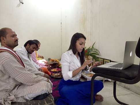 Saumya Vardhan (right), co-founder of shubhpuja.com, prepares for an online service at a temple in Noida, India. Photo: TNS