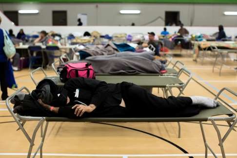 Fort McMurray refugees trying to get some sleep at a community centre in Anzac, Alberta, after fleeing wildfires. Photo: Reuters