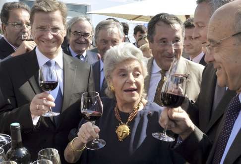 Baroness Philippine de Rothschild (centre) with the mayor of Bordeaux (right) and French minister of agriculture Bruno Le Maire (second right) . Photo: AFP