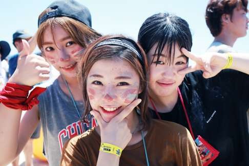Young Koreans get into the spirit at one of the largest mud festivals in the world.