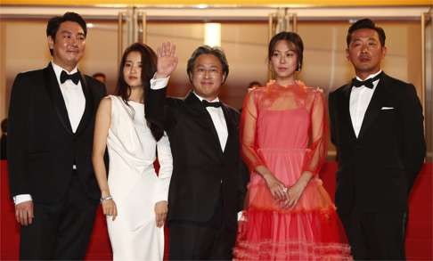 The Handmaiden director Park-Chan-Wook (centre) with (from left) actors Jo Jing-Woong, Kim Tae-ri, Kim Min-hee and Ha Jung-woo arrive for the screening of the film at this year’s Cannes Film Festival.