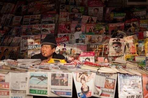 A newspaper vendor waits for customers in Beijing. The success of China’s soft-power status is unclear, but many nations continue to view China through a pragmatic rather than an ideological lens. Photo: AFP